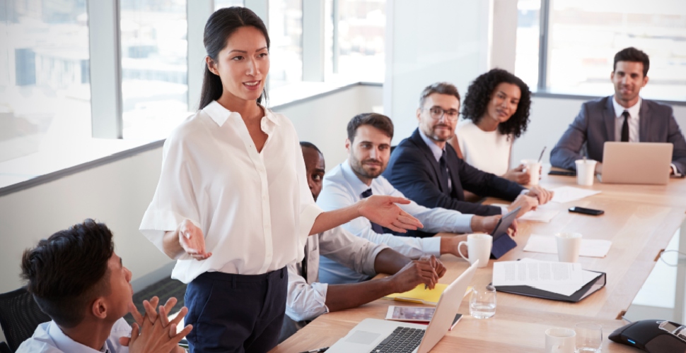 A group of people having a discussion in a work setting