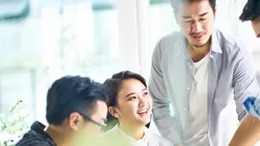 Group of people having a brainstorming session in a bright office.