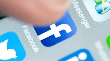 A screen of a phone with popular social media logo.