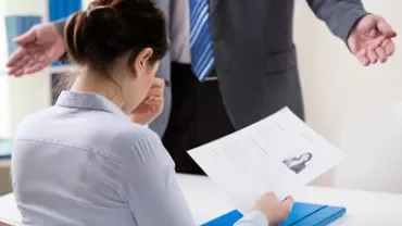 Woman reviewing her resume at a job interview