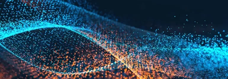 Abstract digital wave with blue and orange particles on a dark background.