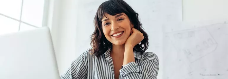 A professional woman smiling.