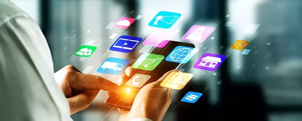 Person using smartphone with app icons floating around.