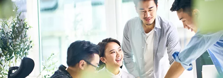 Group of people having a brainstorming session in a bright office.
