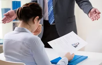 Woman reviewing her resume at a job interview
